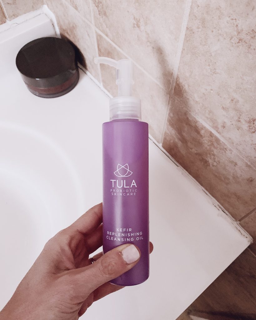 bottle of Tula probiotic skincare kefir replenishing cleansing oil for face skincare routine